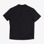 The Linen Resort Shirt in black — back view showing the logo embroidered on the yoke