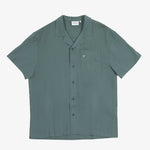 The Linen Resort Shirt in sage — flat lay with camp collar and chest pocket