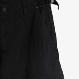 The Monterrey Cargo Pant in black — close-up of the adjustable waist and pocket embroidery