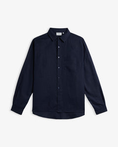 The Daily Linen Shirt in navy — front view against a white background