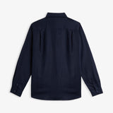 The Daily Linen Shirt in navy — back view showing the pleated back yoke