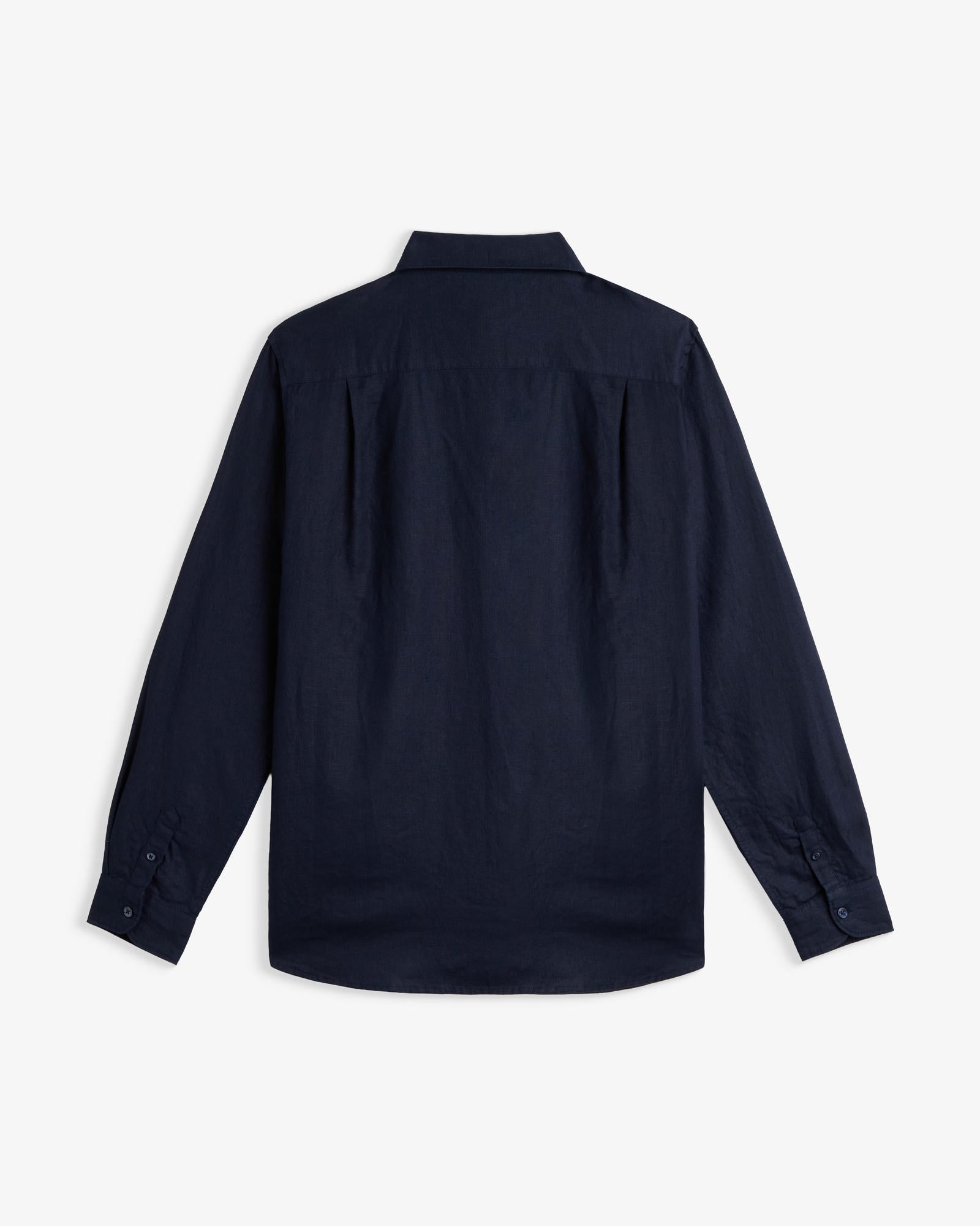 The Daily Linen Shirt in navy — back view showing the pleated back yoke