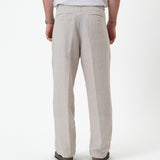 The Daily Linen Trouser in natural — back view with functional welt pockets