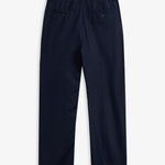 The Daily Linen Trouser in navy — back view showing functional welt pockets