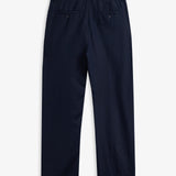 The Daily Linen Trouser in navy — back view showing functional welt pockets