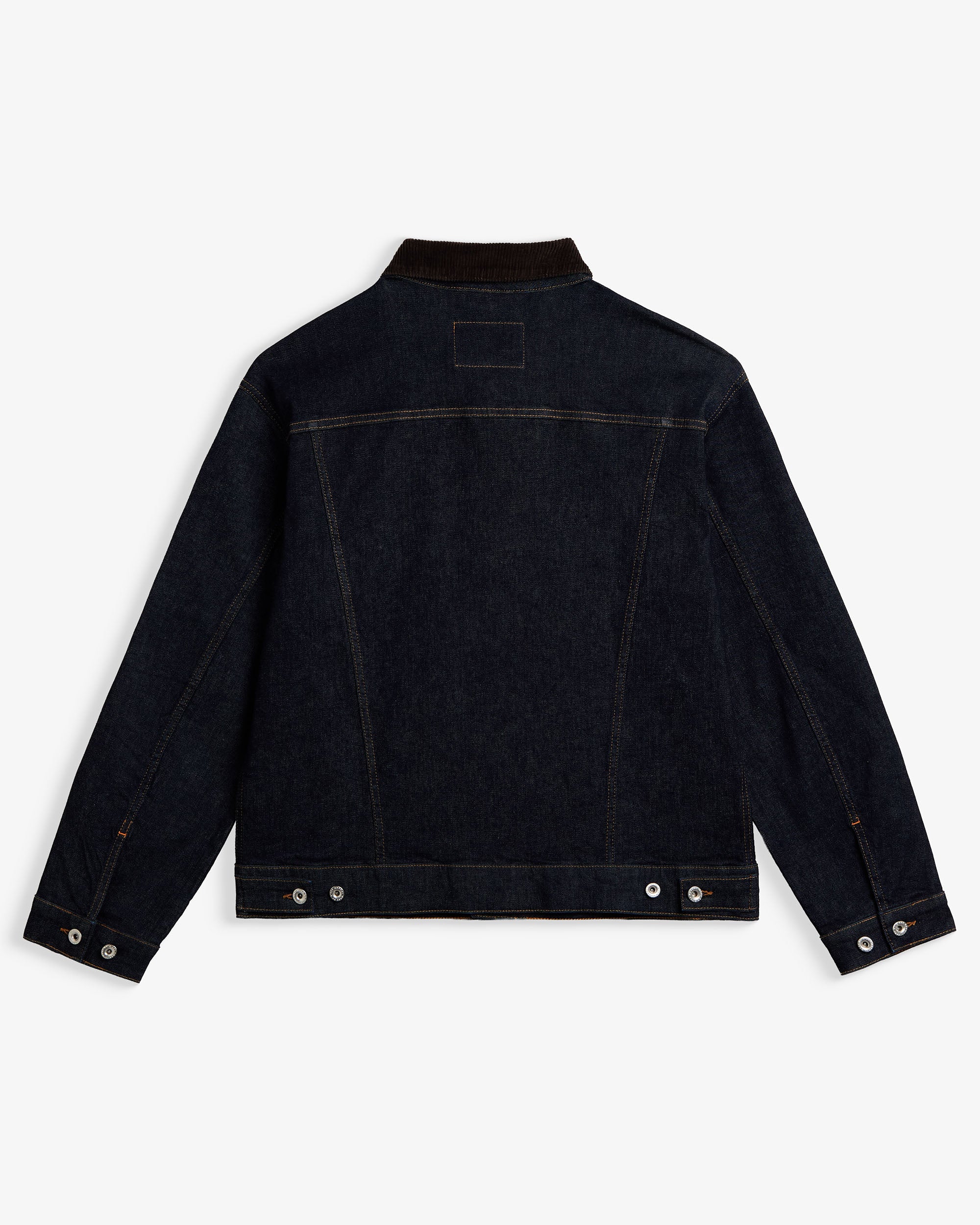 The Denim Jacket in rinse blue — back view showing the dark wash and corduroy collar