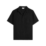 The Holiday Linen SS Shirt in black — front view against a white background