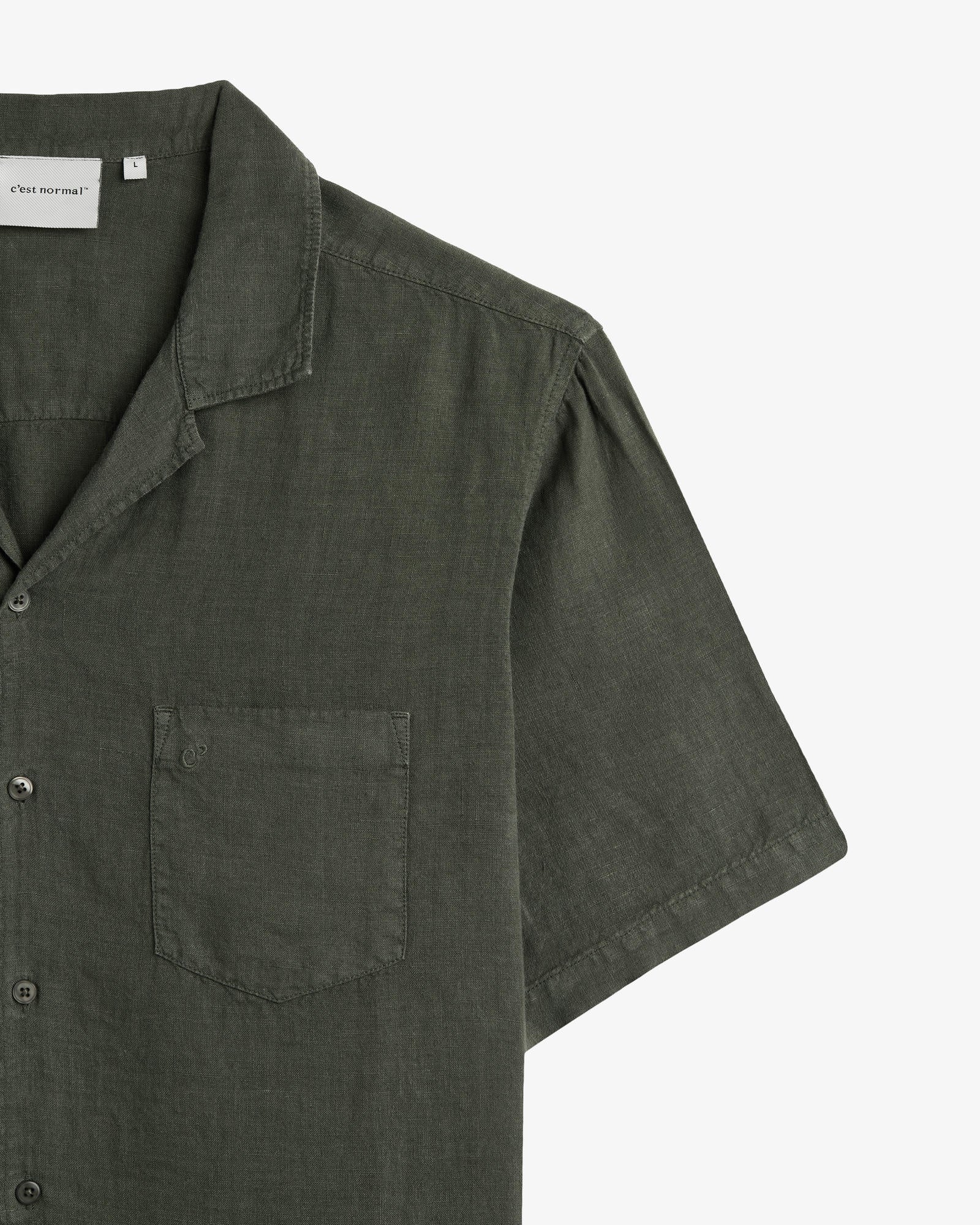 The Holiday Linen SS Shirt in Dark Khaki — close-up of the chest pocket and collar