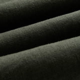 The Holiday Linen SS Shirt in dark khaki — close-up of the textured linen fabric