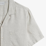 The Holiday Linen SS Shirt in natural — close-up of the chest pocket and linen texture