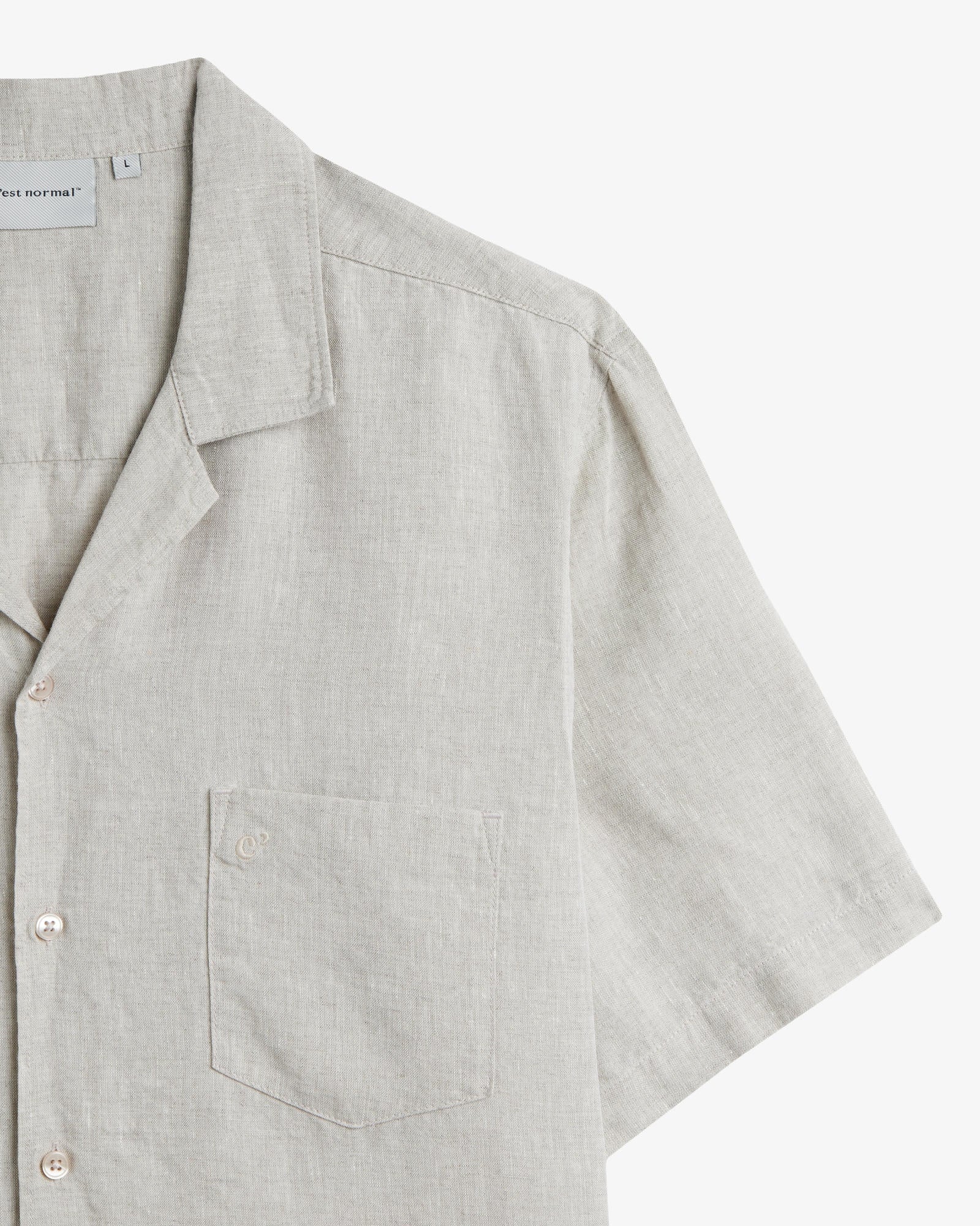 The Holiday Linen SS Shirt in natural — close-up of the chest pocket and linen texture