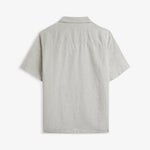 The Holiday Linen SS Shirt in natural — back view against a light grey background