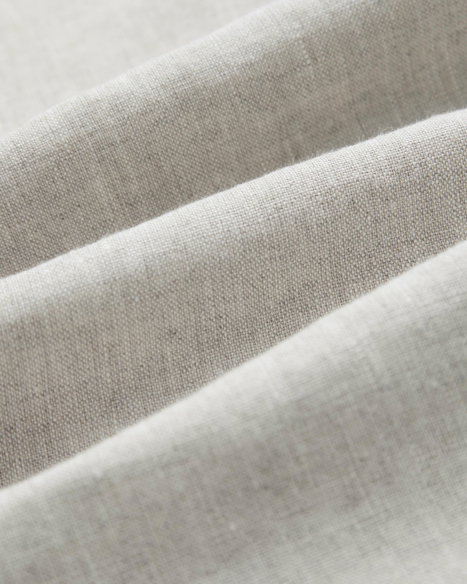 The Holiday Linen SS Shirt in Natural — close-up of the textured fabric weave
