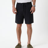 The Holiday Linen Short in black — front view against a white background