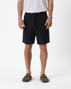 The Holiday Linen Short in black — front view against a white background