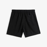 The Holiday Linen Short in black — back view showing the elastic waistband and pocket