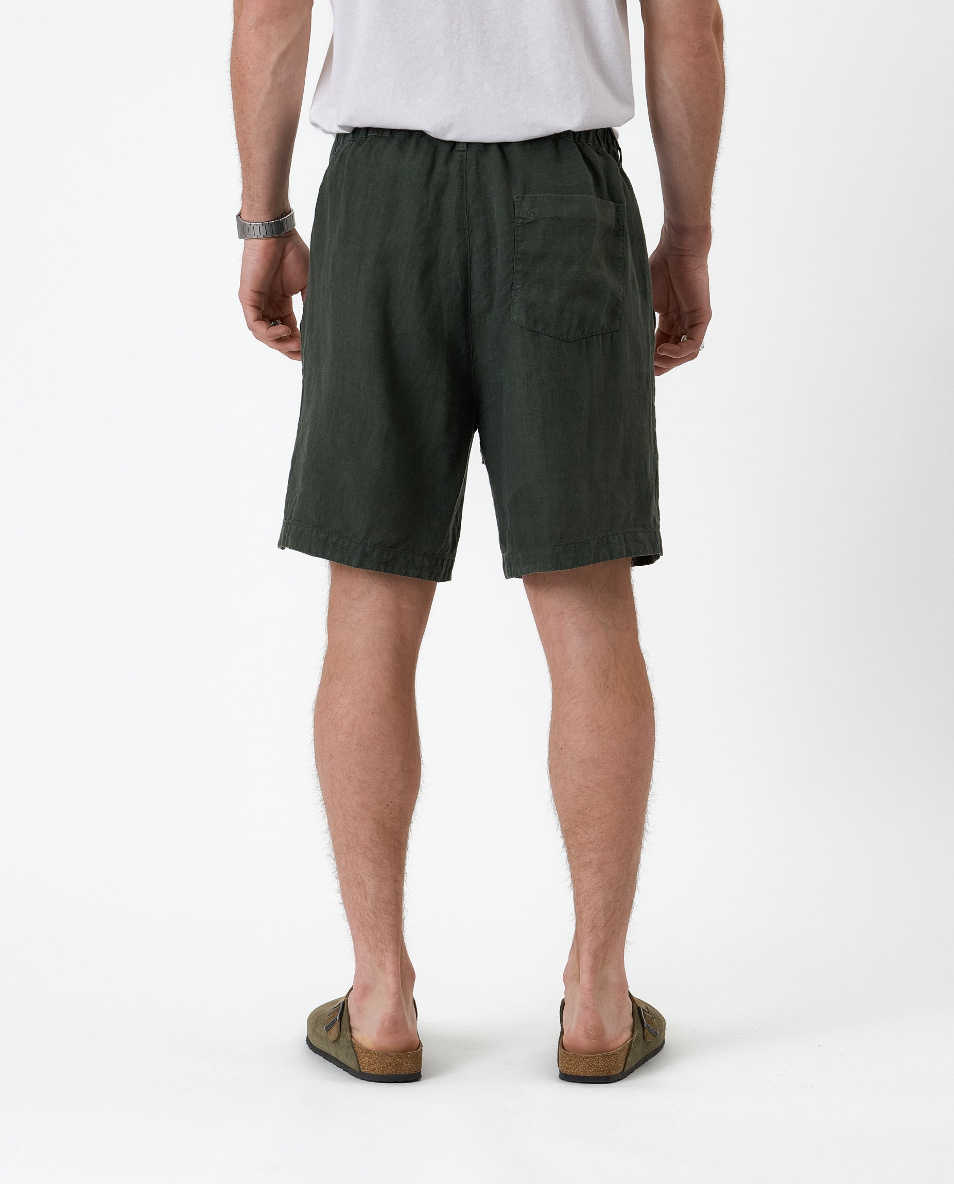 The Holiday Linen Short in dark khaki — back view showing the rear pocket and waistband