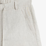 The Holiday Linen Short in natural — featuring tonal C'est normal embroidery near the pocket