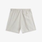 The Holiday Linen Short in natural — back view showing the rear pocket