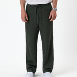 The Holiday Linen Trouser in dark khaki — front view with a drawstring waist