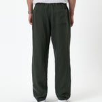 The Holiday Linen Trouser in Dark Khaki — back view showing the elastic waistband and pocket