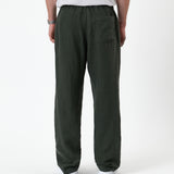 The Holiday Linen Trouser in Dark Khaki — back view showing the elastic waistband and pocket