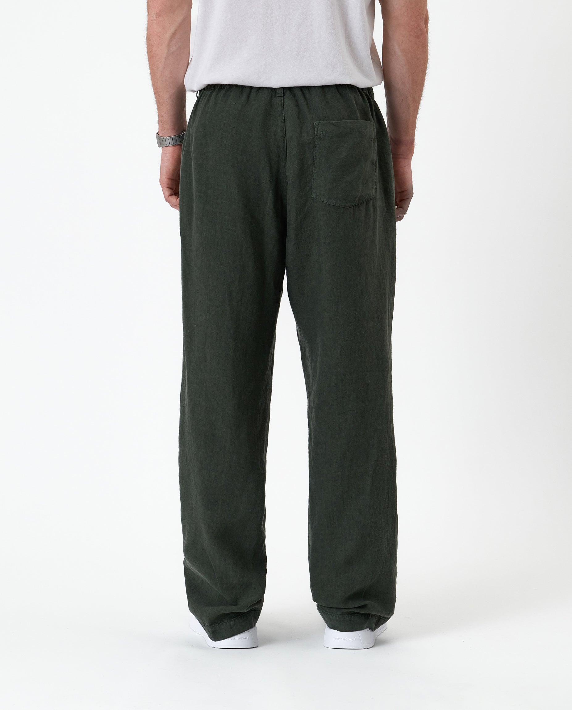The Holiday Linen Trouser in Dark Khaki — back view showing the elastic waistband and pocket