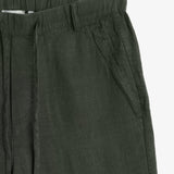 The Holiday Linen Trouser in dark khaki — close-up of the elasticated waistband and pocket