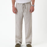 The Holiday Linen Trouser in natural — front view showing the drawstring waist