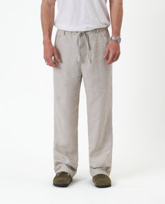 The Holiday Linen Trouser in natural — front view showing the drawstring waist