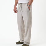 The Holiday Linen Trouser in natural — side angle view against a white background
