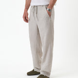The Holiday Linen Trouser in natural — side angle view against a white background