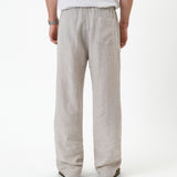 The Holiday Linen Trouser in natural — back view against a white background