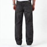 The Jeans Relaxed Straight Fit in faded black — back view with a rubber patch at the waist