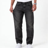 The Jeans Relaxed Straight Fit in faded black — front view demonstrating fabric stretch