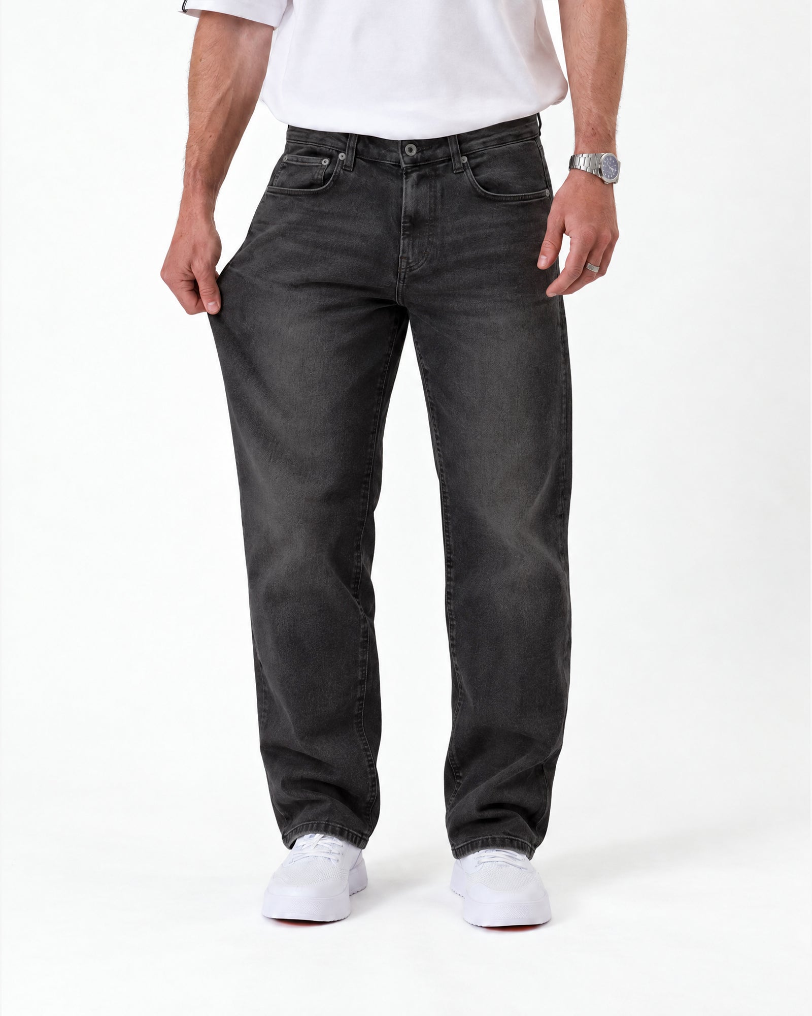The Jeans Relaxed Straight Fit in faded black — front view demonstrating fabric stretch