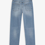A back view of The Jeans Relaxed Straight Fit in Light Midwash, laid flat on a white background. The image highlights the two back pockets, the subtle orange accent stitching, and the rubber patch at the back waist with the c'est normal logo.