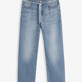 A front view of The Jeans Relaxed Straight Fit in light midwash, laid flat on a white background. The image highlights the front pockets, button closure, and a white drawstring at the waist.