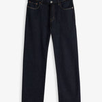 A front view of The Jeans Relaxed Straight Fit in Rinse Wash, laid flat on a white background. The image highlights the straight leg silhouette, zip fly with top button, front pockets, subtle orange accent stitching, and a black drawstring detail at the waist.