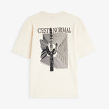 The Oversized Printed T-shirt in cream — back graphic featuring a cactus and C'est normal text