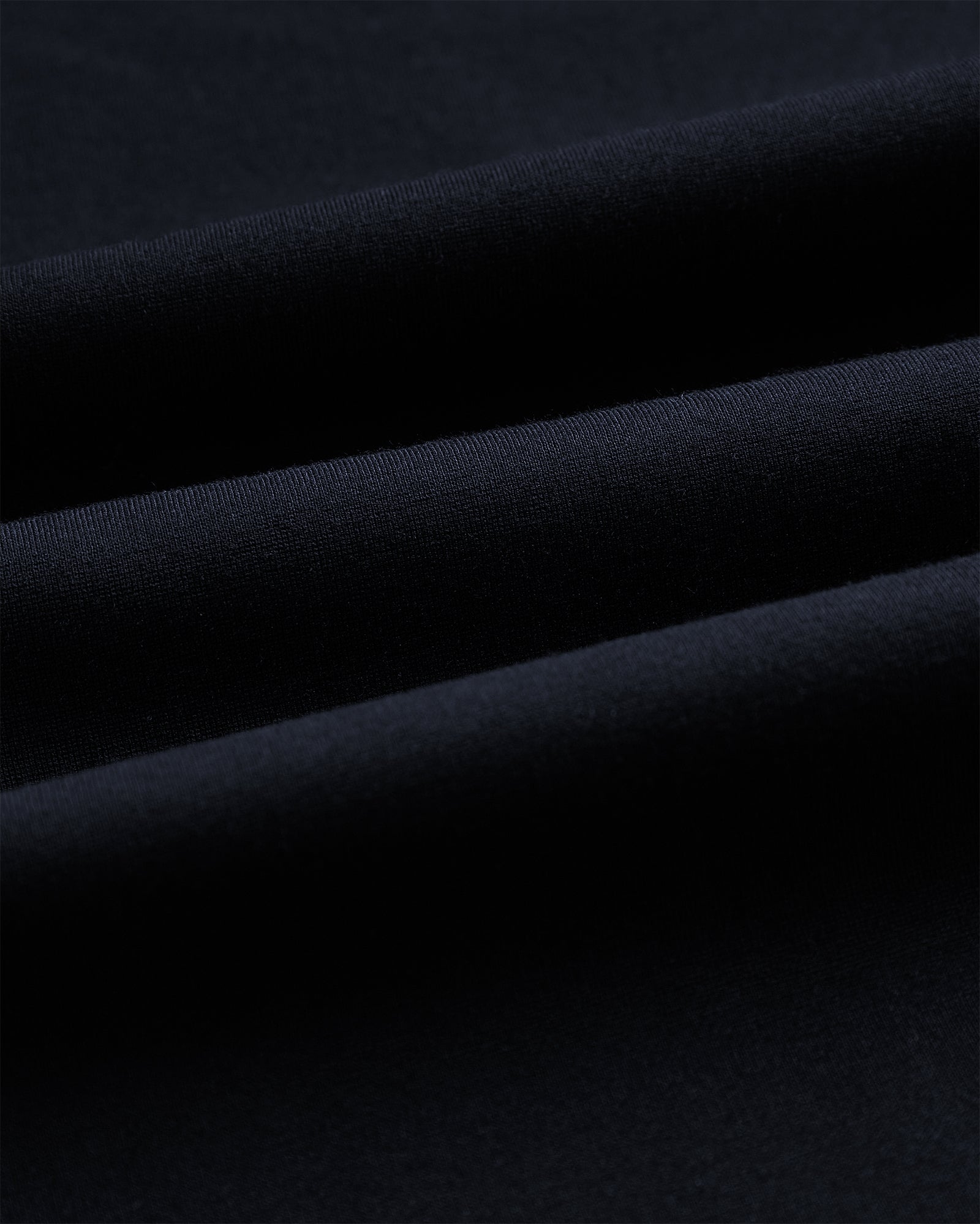The Proper Pant Relaxed Straight Fit in navy — close-up of the fabric texture.