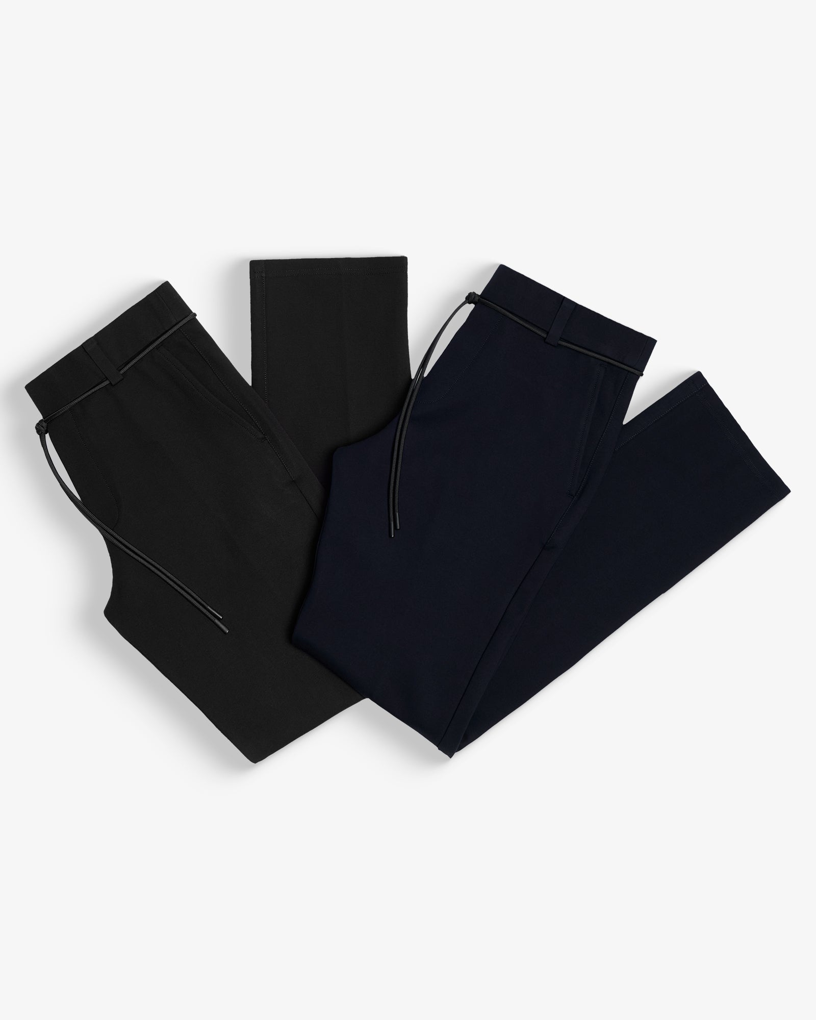 The Proper Pant Relaxed Straight Fit in black and navy — folded flat showing the drawcords