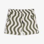 A front view of The Shorts in an olive curl stripe pattern, laid flat on a white background. The image highlights the wavy design, elasticated waistband with a drawstring, and notched hem.