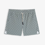 A front view of The Shorts in Tile, laid flat on a white background. The image highlights the elastic waistband, white drawstring with black tips, side pockets, and notched hems of the c'est normal shorts.