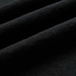 The Sanremo Linen Tee in antrasit — close-up of the textured linen-cotton blend fabric