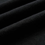 The Sanremo Linen Tee in antrasit — close-up of the textured linen-cotton blend fabric