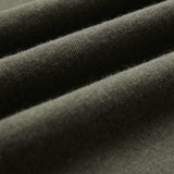 The Sanremo Linen Tee in Mulled Green — close-up of the textured linen-cotton jersey fabric