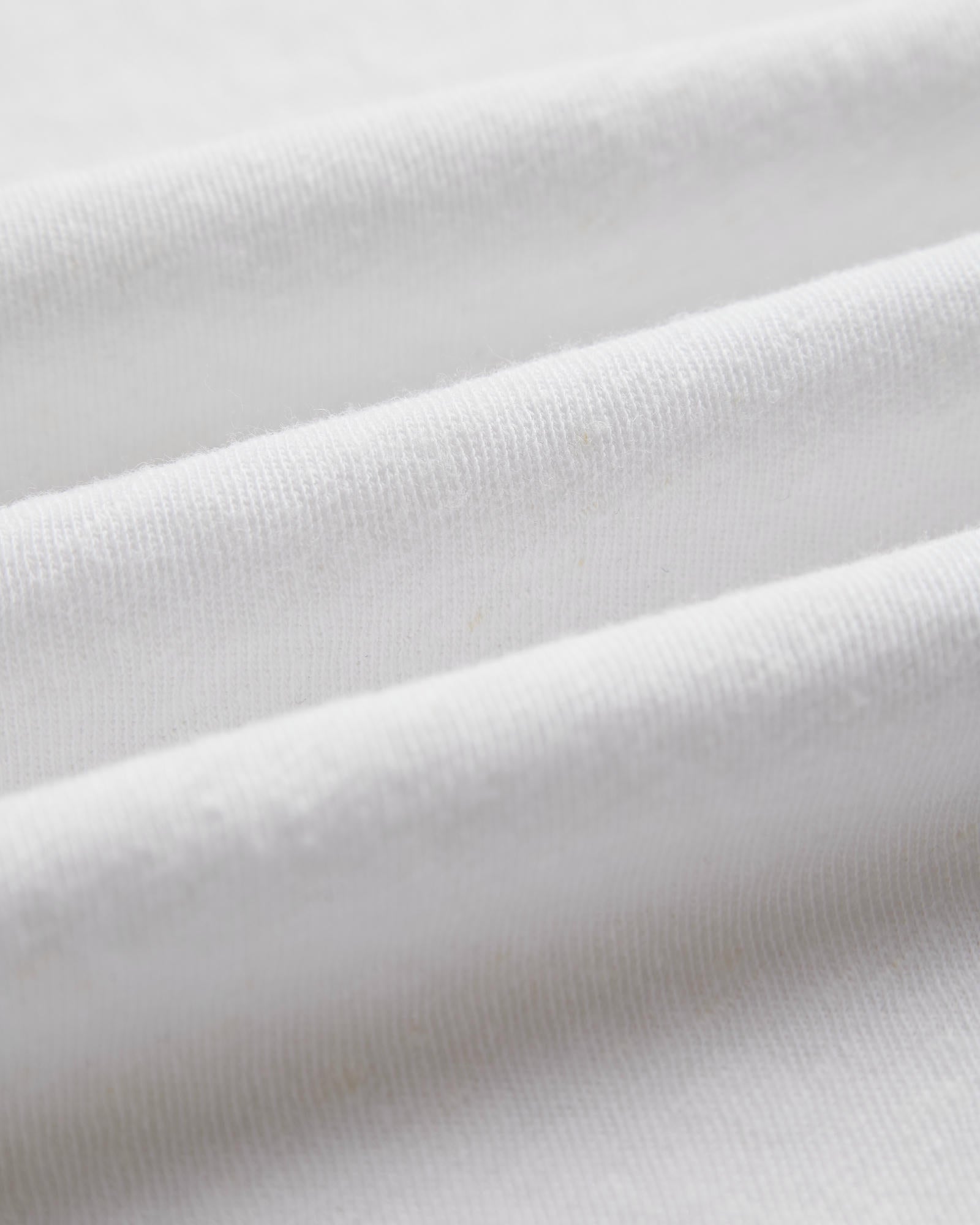 The Sanremo Linen Tee in white — close-up showing the textured jersey fabric
