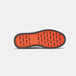 The Sneakers 2.0 in khaki — bottom view showing the original orange rubber grid sole