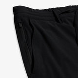 The Board Shorts in black — detail view of the zippered side pocket